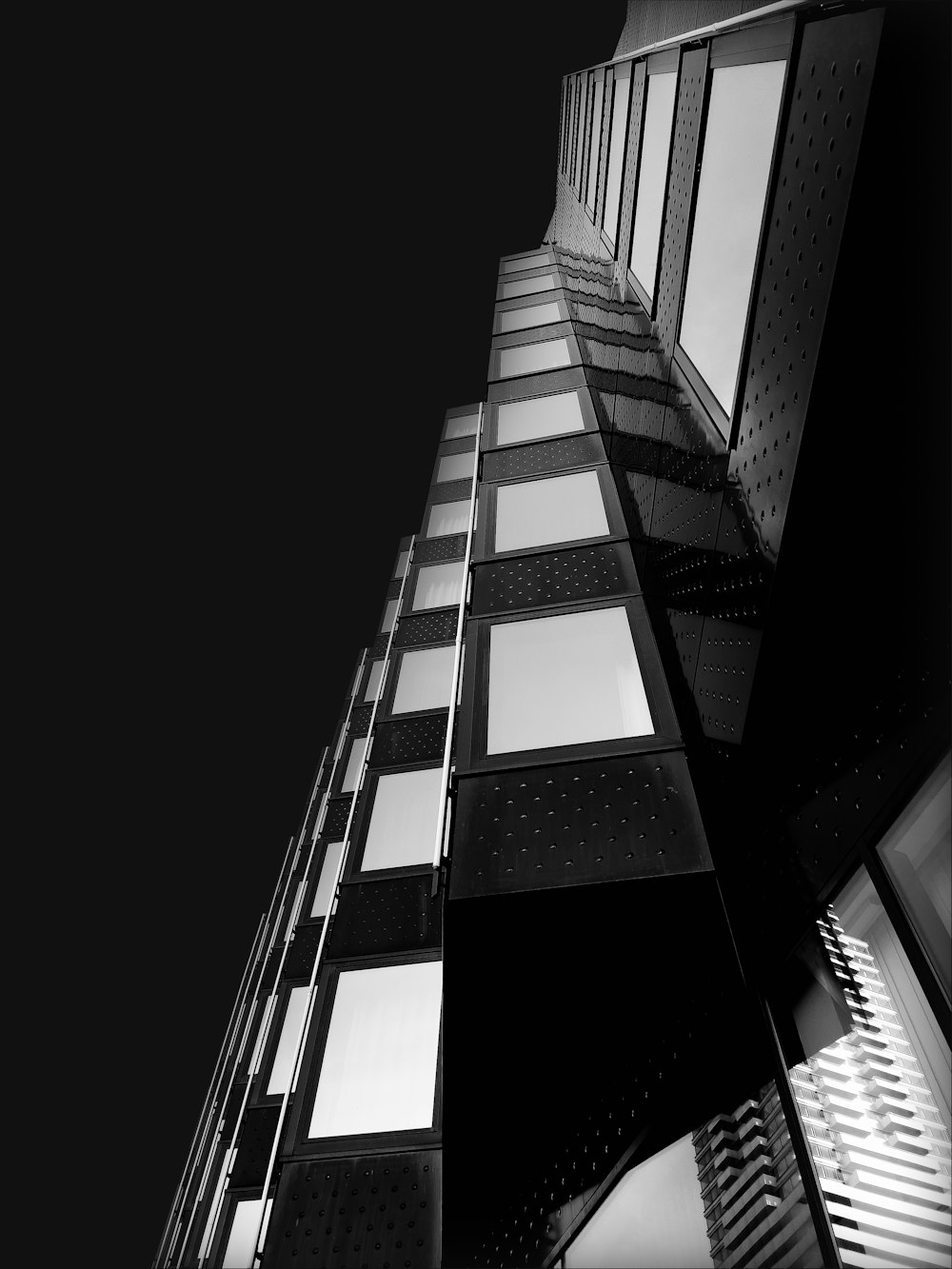 a black and white photo of a tall building