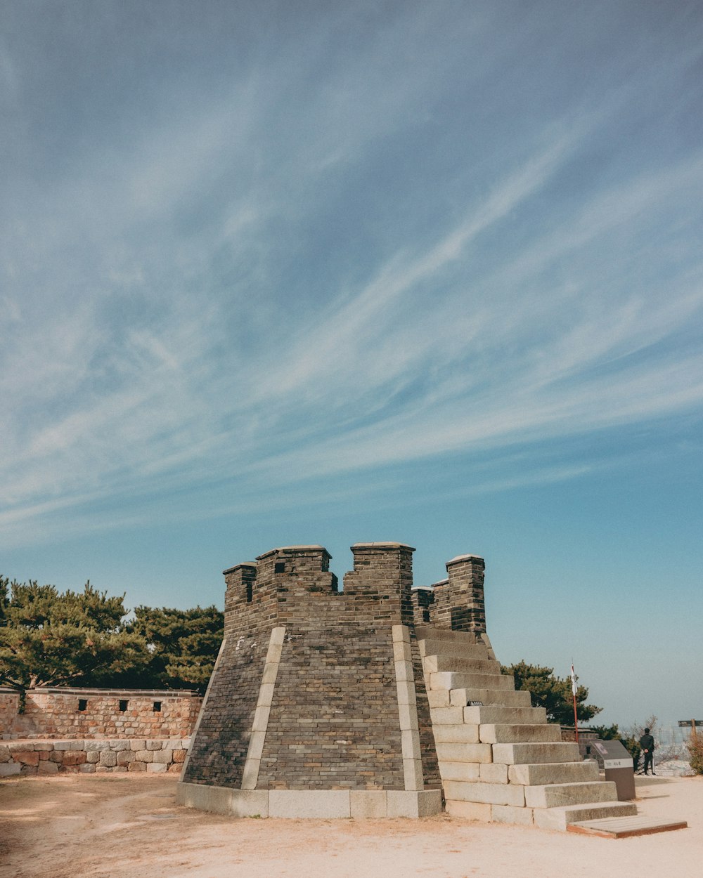 a stone structure with steps leading up to it