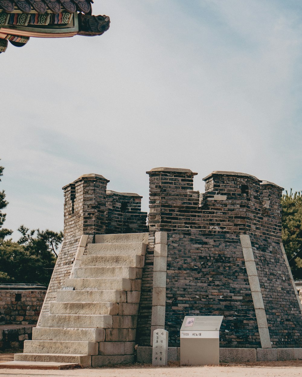 a stone structure with steps leading up to it