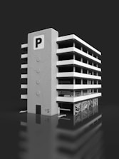 a white building with a parking meter in front of it