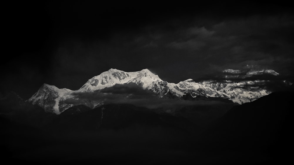 a black and white photo of a mountain range