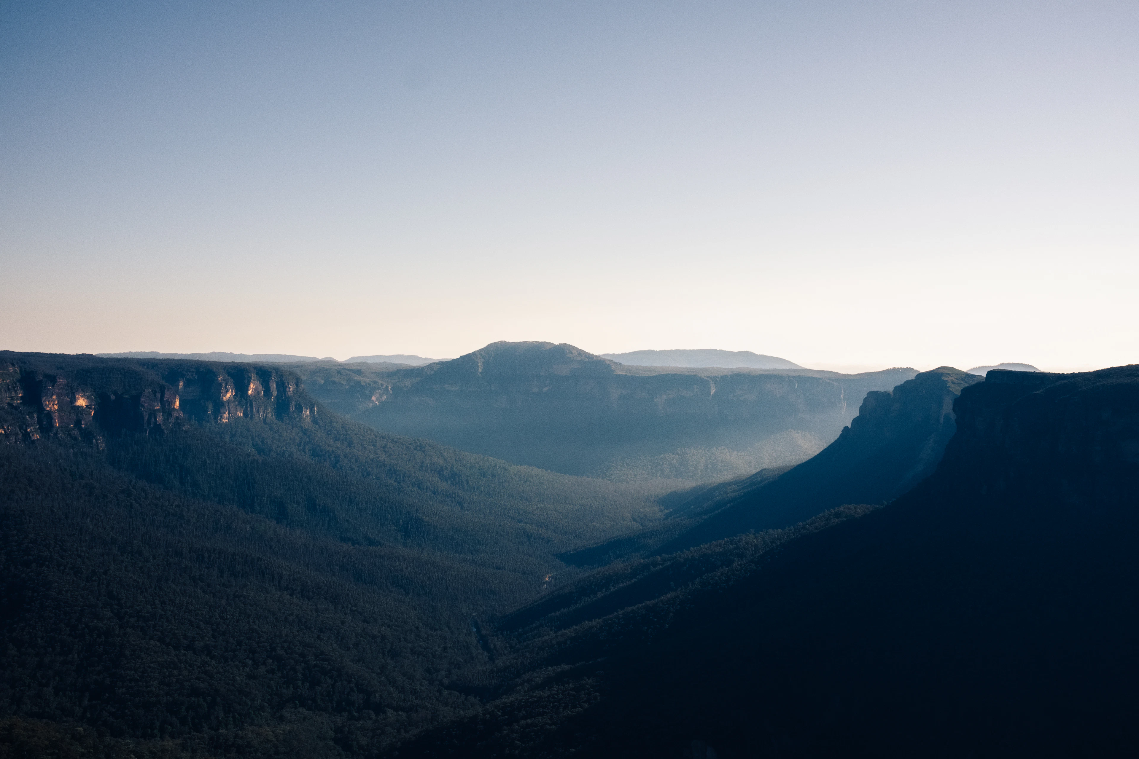 Mountain ridges surrounding a deep forested valley