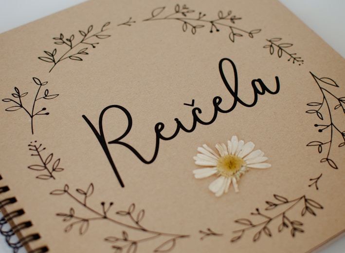 a spiral notebook with the word relax written on it