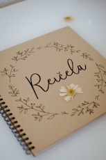 a spiral notebook with the word relax written on it