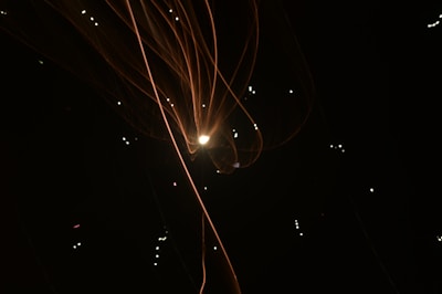 A sophisticated dark background with glowing orange accents representing a visionary journey.