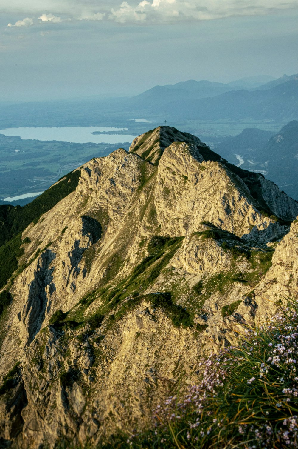 a view of a mountain with a bench on top of it