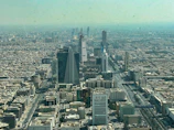 an aerial view of a city with tall buildings