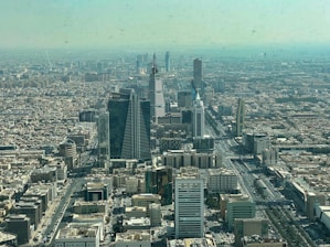 an aerial view of a city with tall buildings