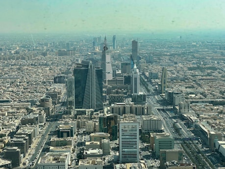 an aerial view of a city with tall buildings