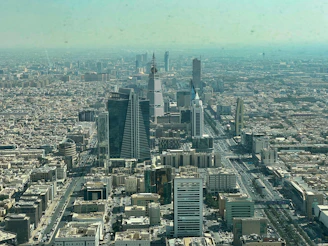 an aerial view of a city with tall buildings