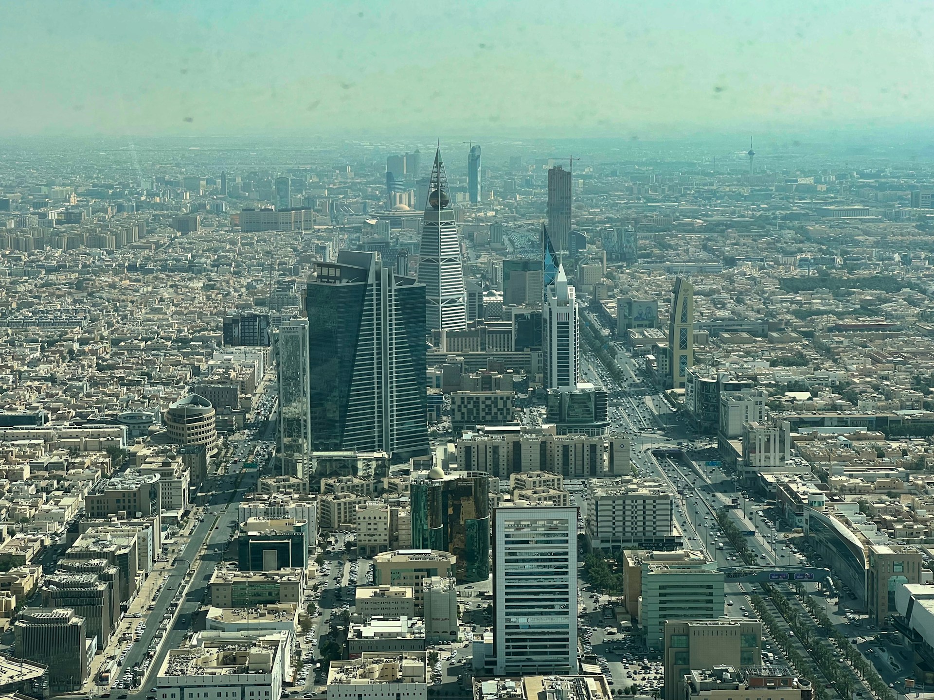 an aerial view of a city with tall buildings