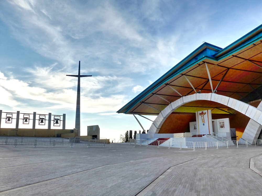 a large building with a cross on top of it