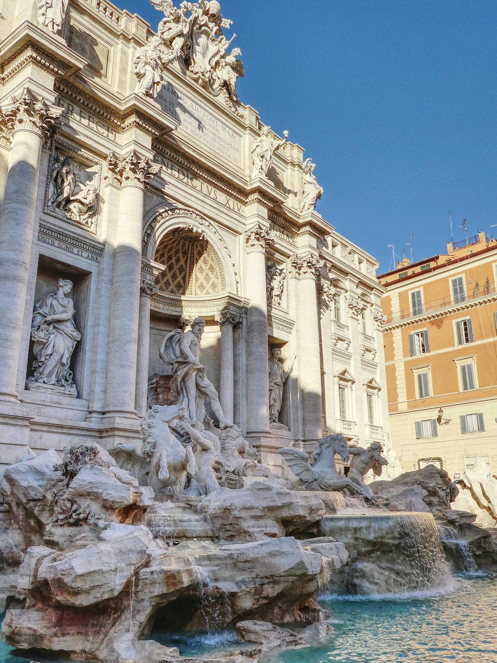 a building with a fountain in front of it