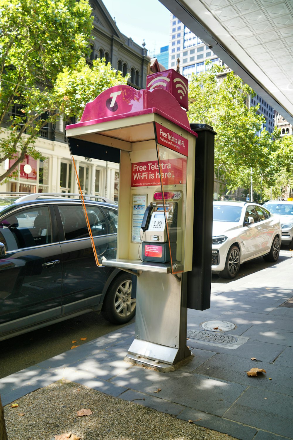 a parking meter sitting on the side of a road