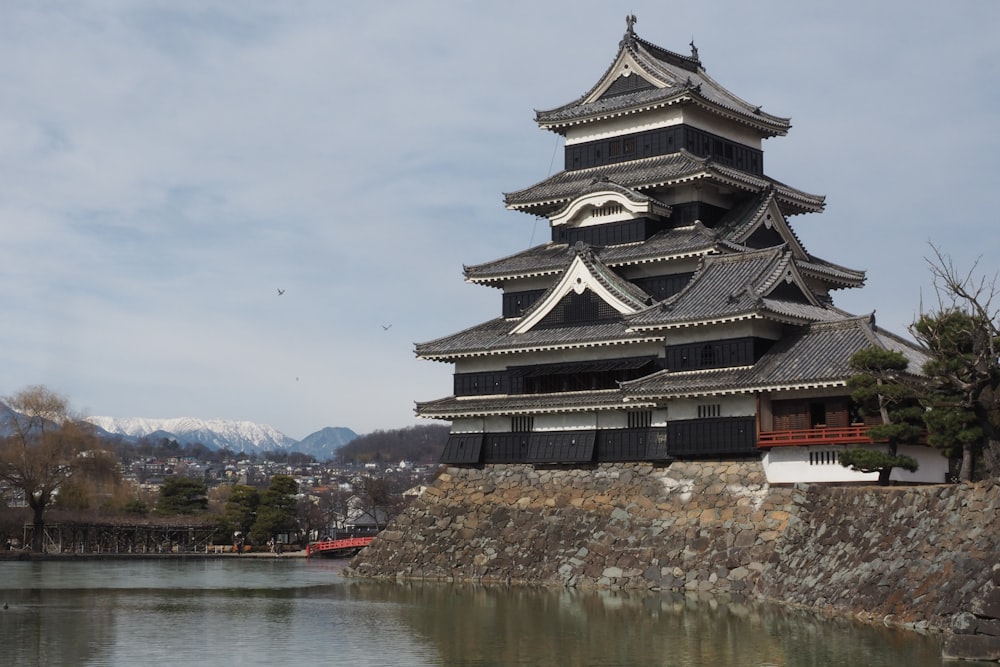 a tall building next to a body of water