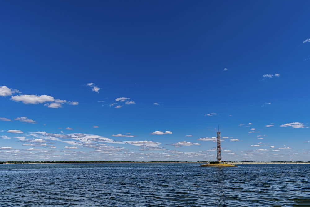 a large body of water with a tower in the middle of it