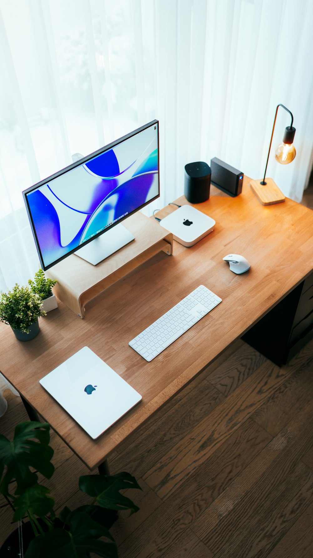 a wooden desk with a computer on it