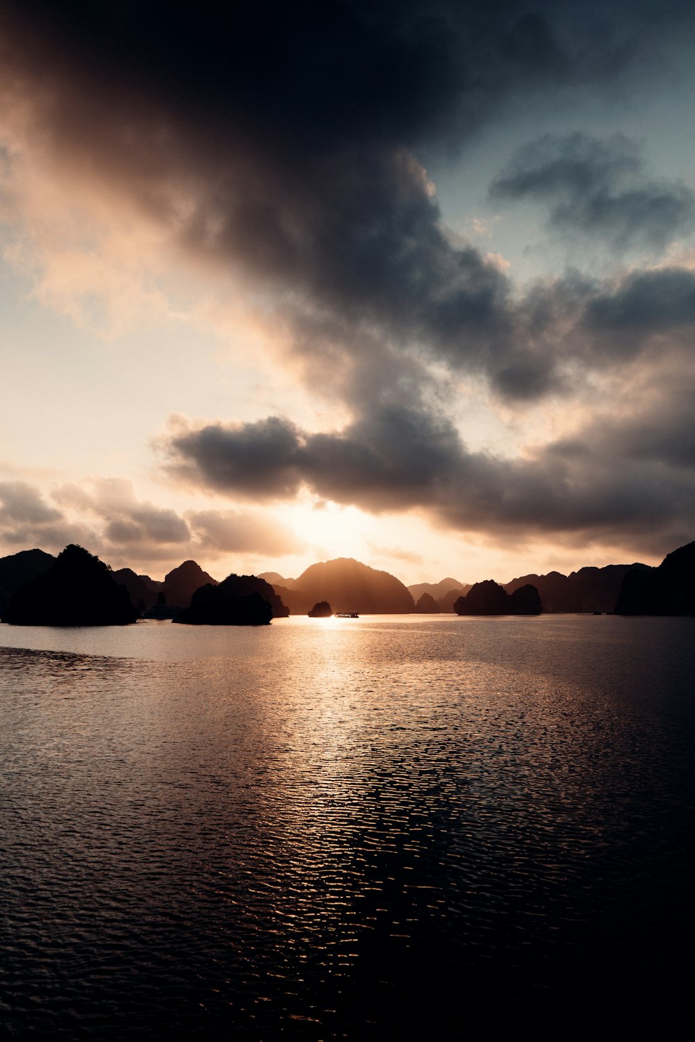 a large body of water under a cloudy sky