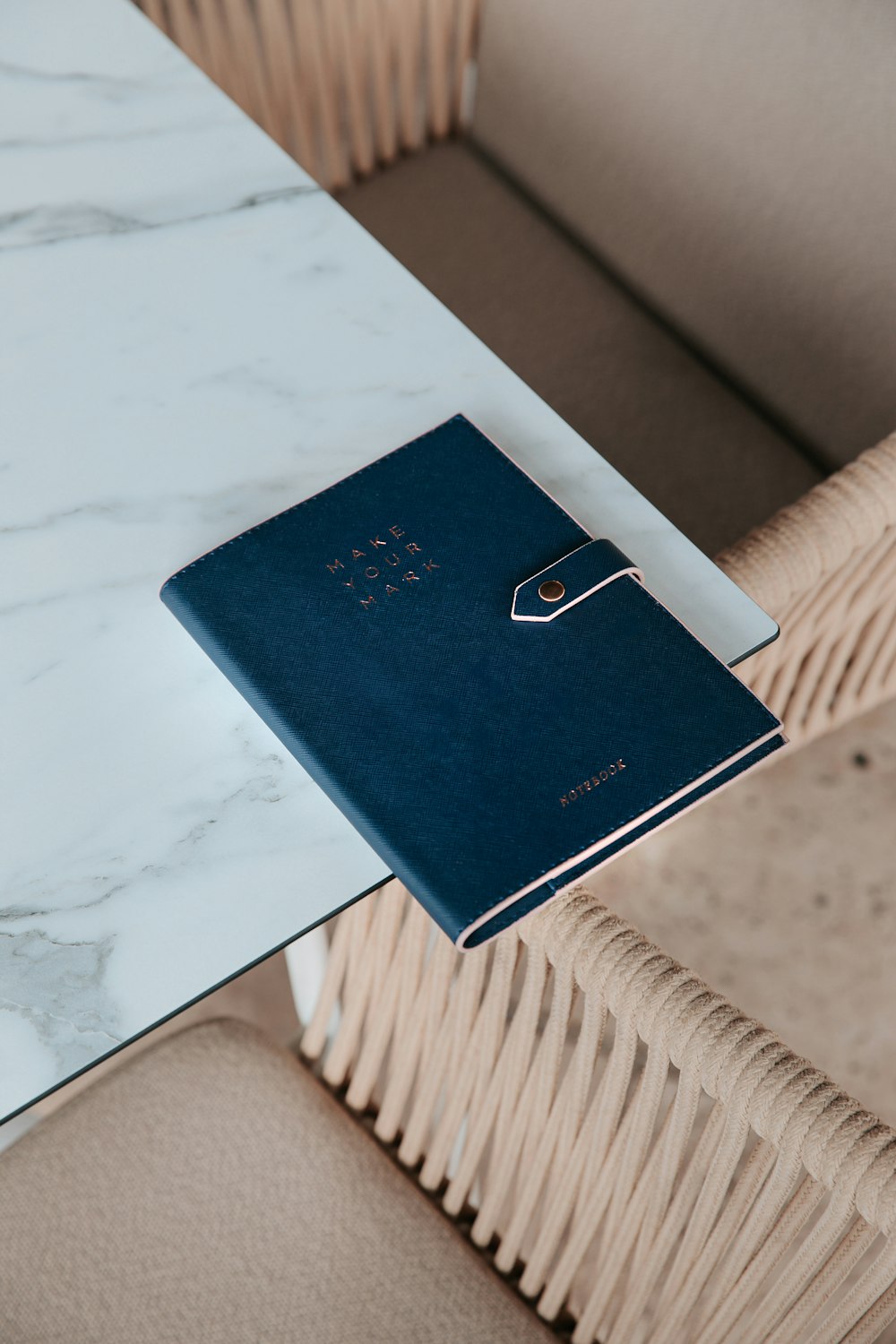 a blue book sitting on top of a white table