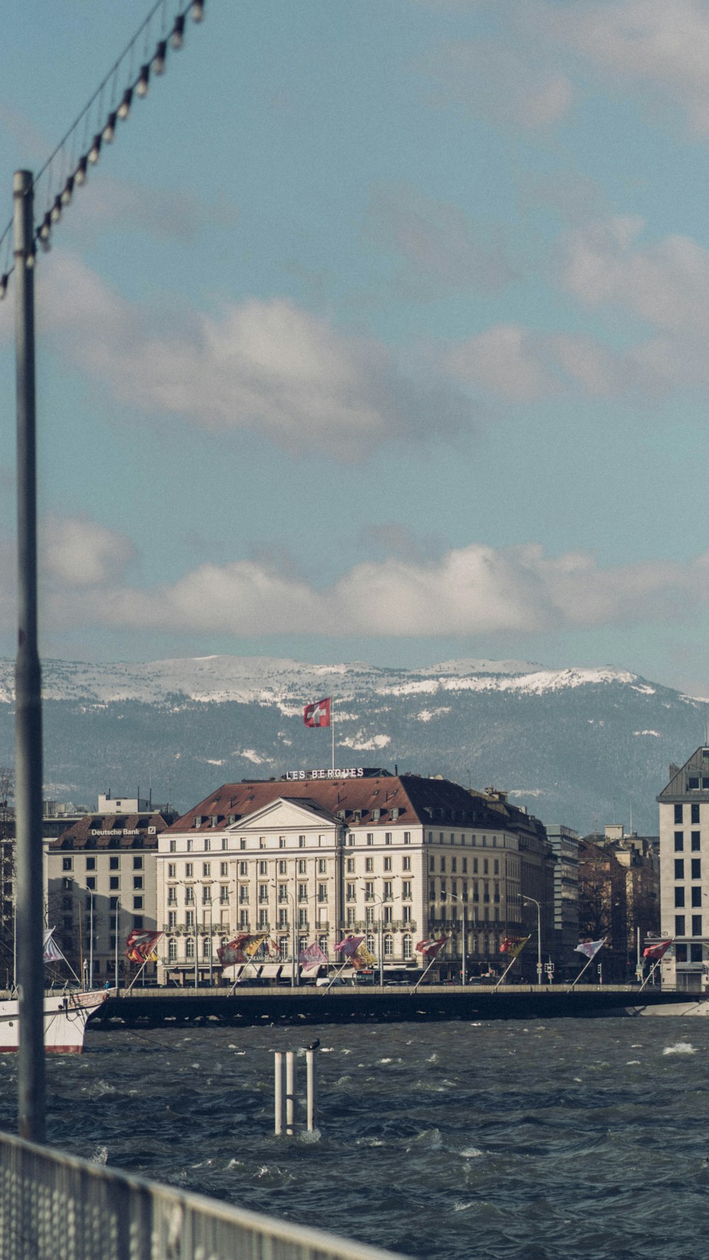 a large body of water next to a large white building