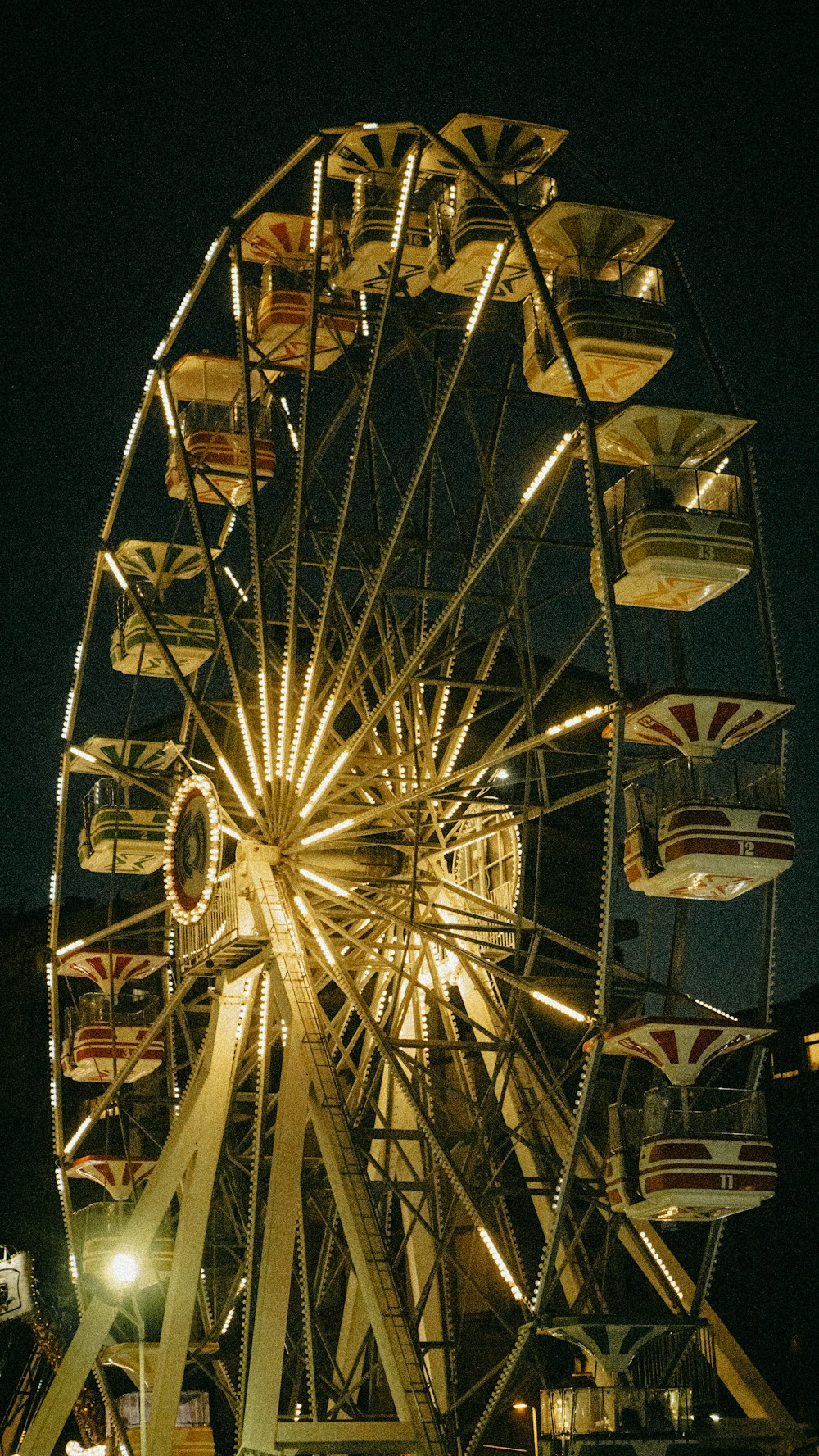 a ferris wheel lit up at night time