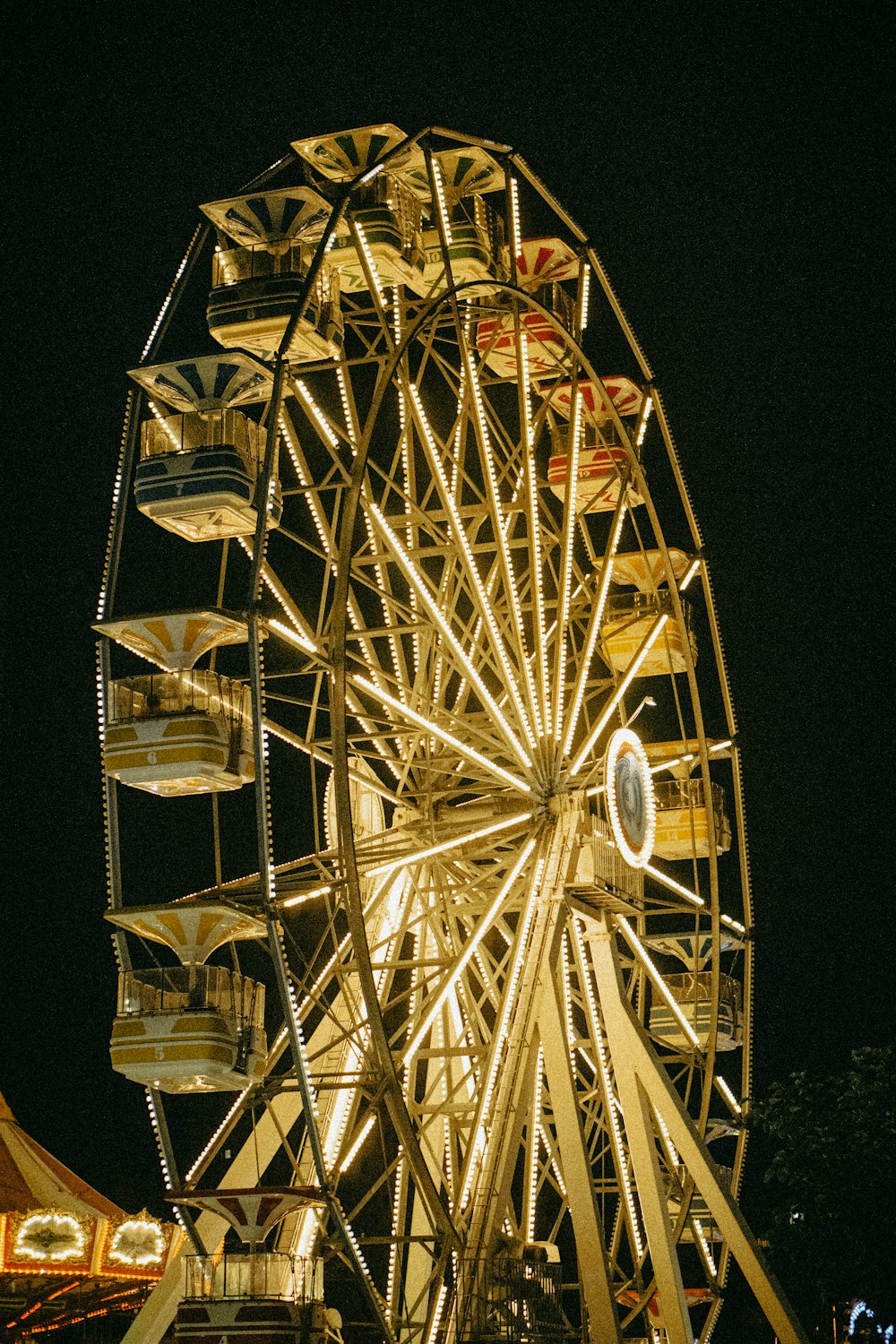 a ferris wheel at a carnival at night