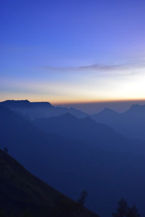 A serene mountain landscape at dawn symbolizing calm and reliability.