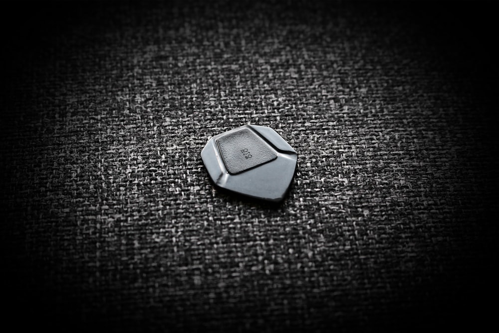 a black and white photo of a button