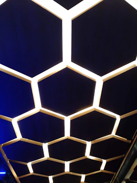 a close up of a ceiling made of hexagonal shapes