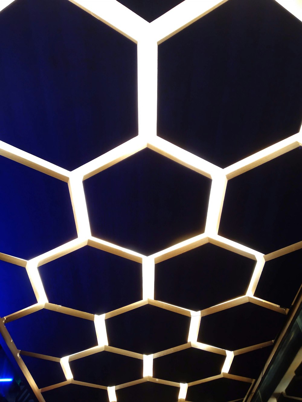 a close up of a ceiling made of hexagonal shapes