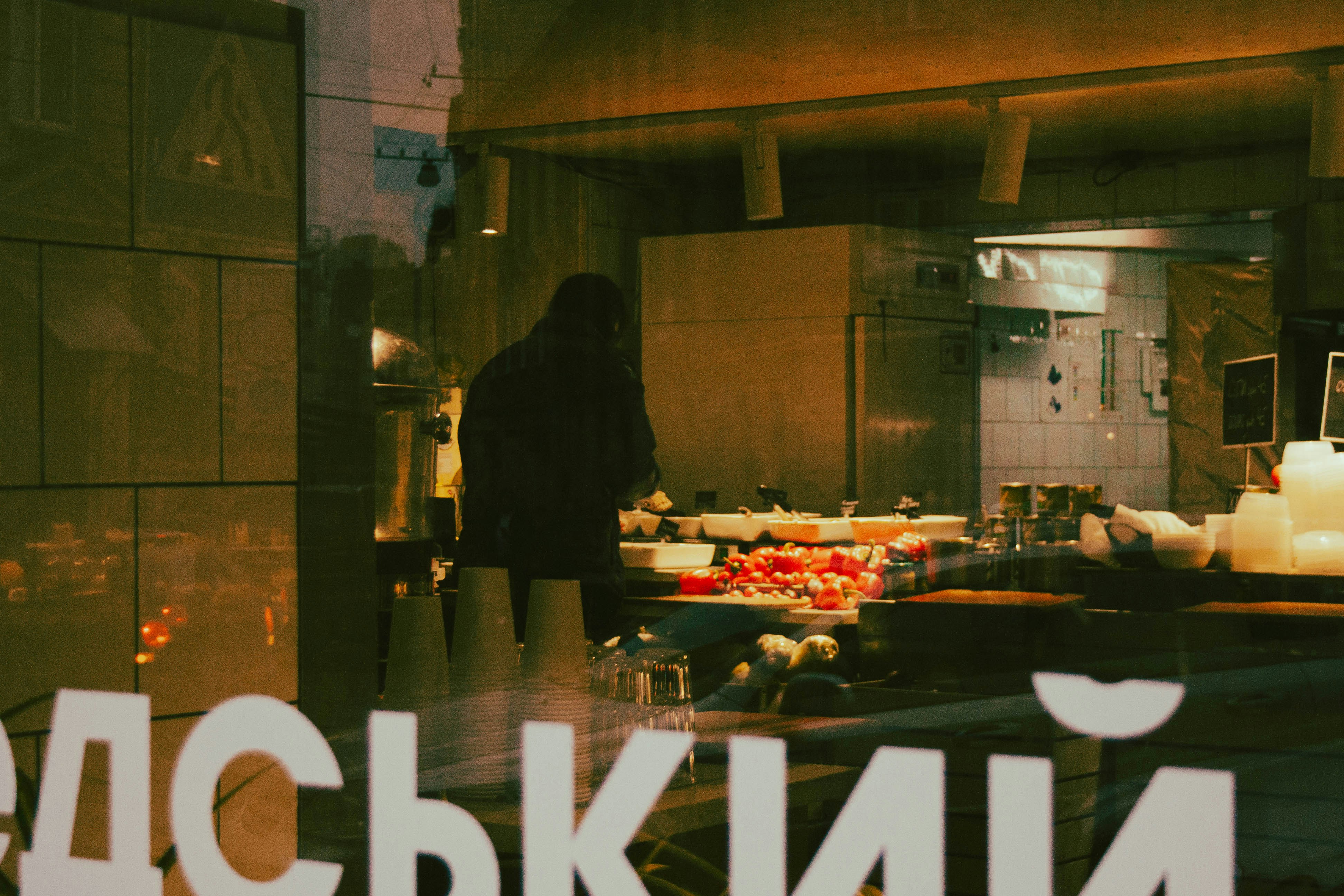 a reflection of a woman in a window