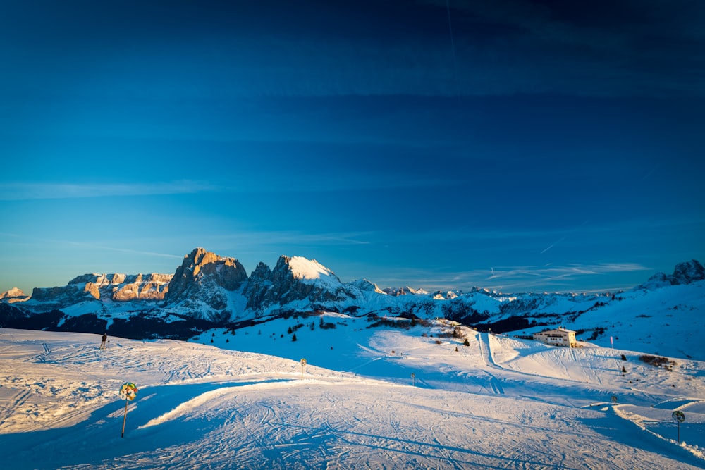 a group of people riding skis on top of a snow covered slope