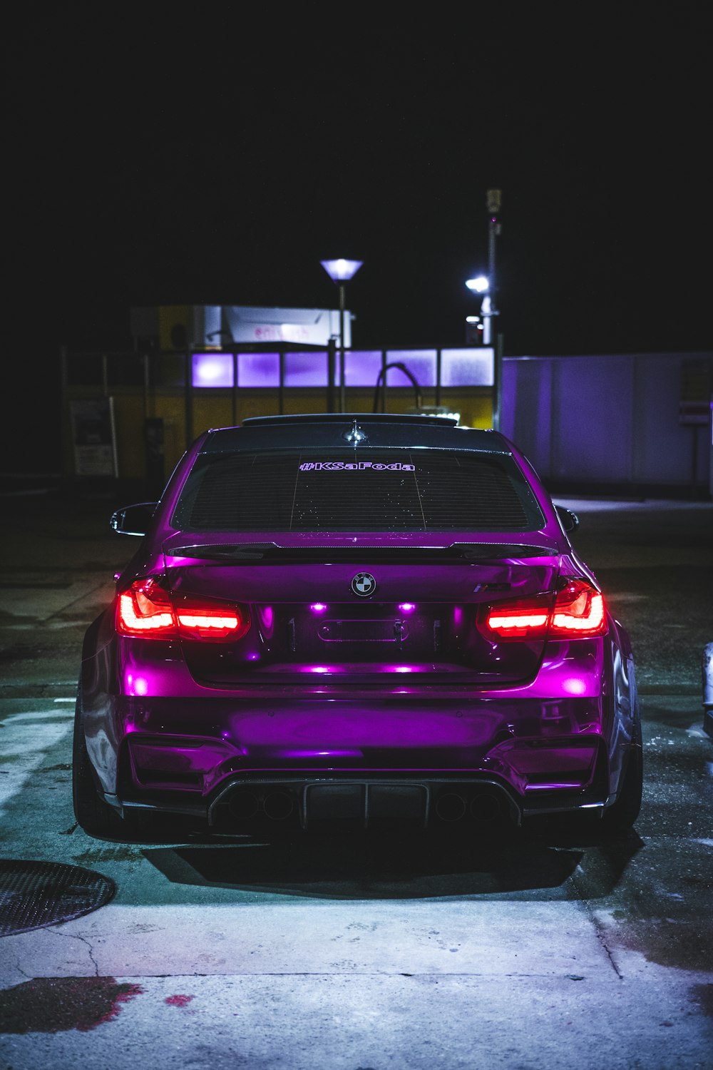 a car parked in a parking lot at night