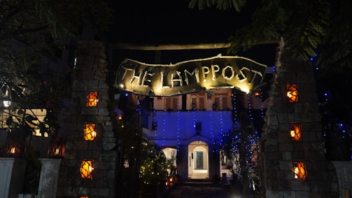 A welcoming office entrance with warm lighting and a sign for lamplighter property group, llc.