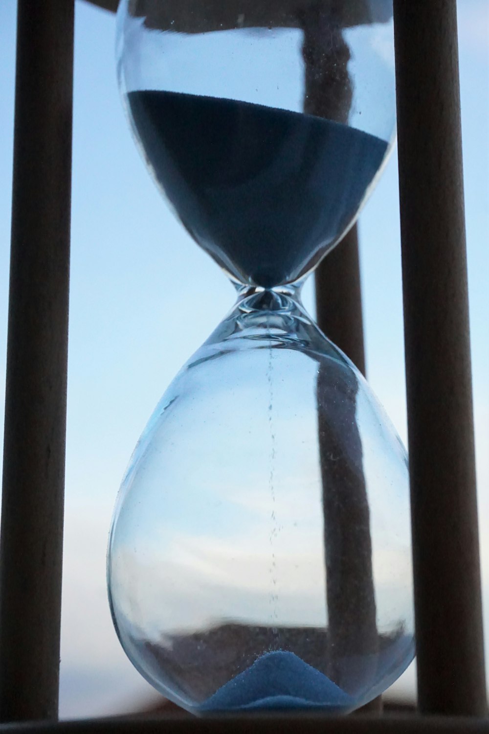 an hourglass sitting on top of a wooden table