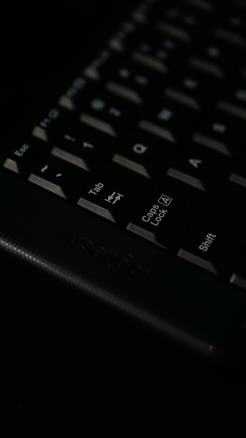 a close up of a black computer keyboard