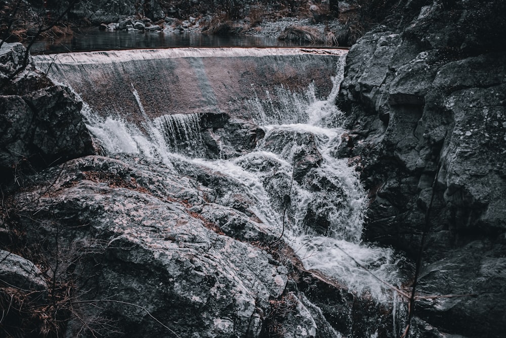 a waterfall with water coming out of it