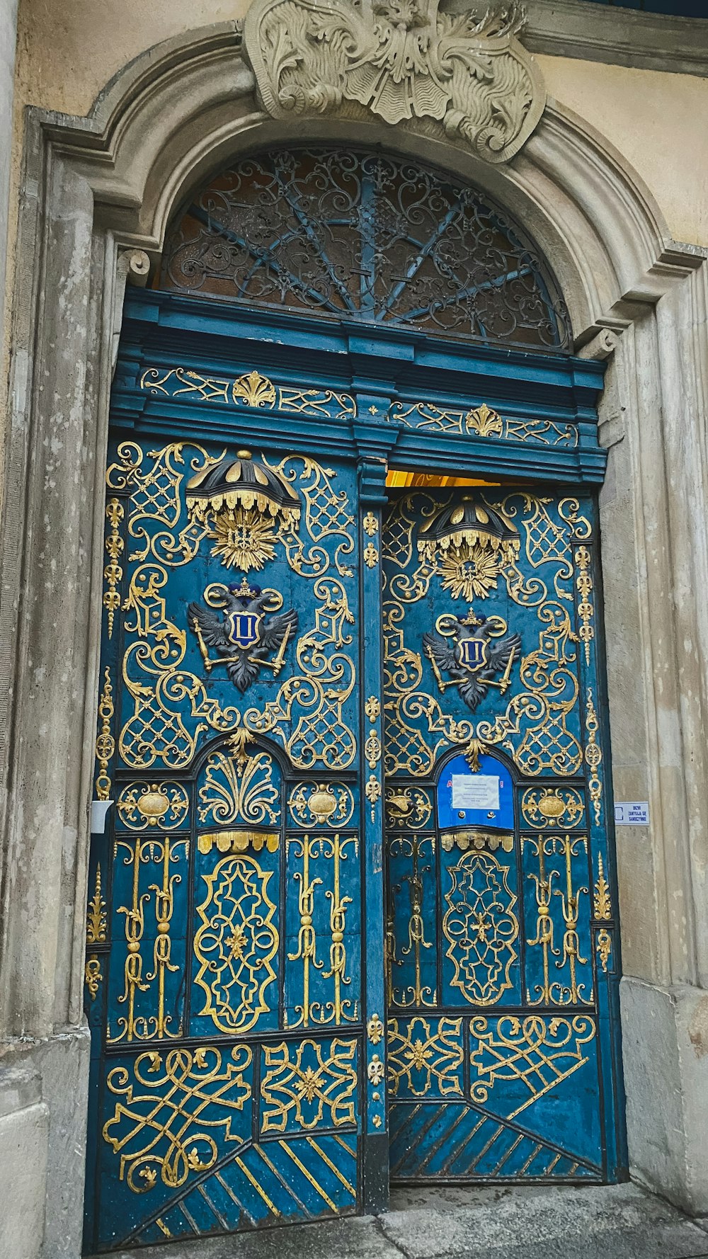 a blue and gold door with ornate designs on it