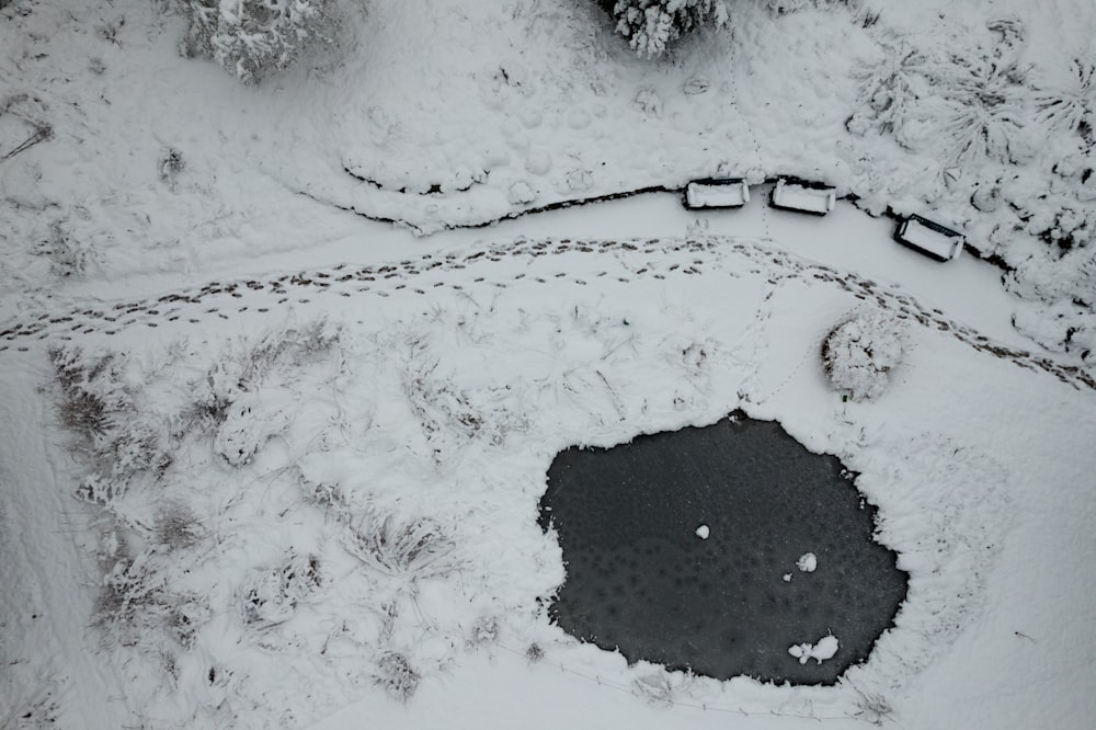 an aerial view of a snow covered field