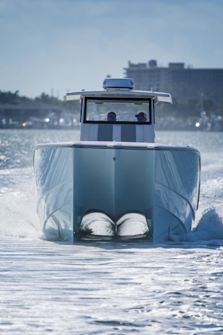 a blue boat with two seats in the water