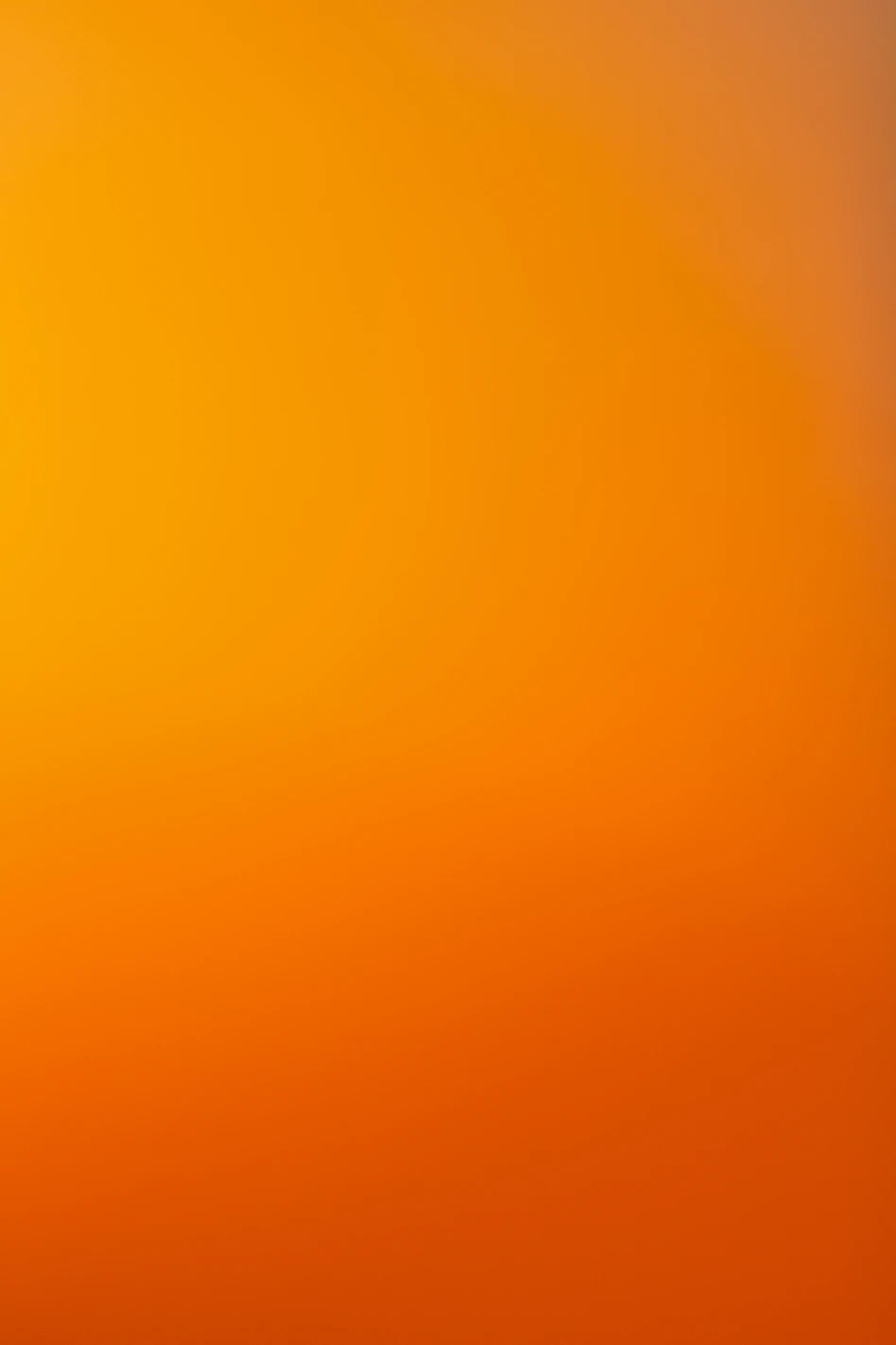 an airplane flying in the sky at sunset