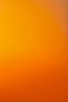 an airplane flying in the sky at sunset