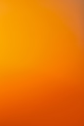 an airplane flying in the sky at sunset