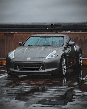 a silver sports car parked in a parking lot