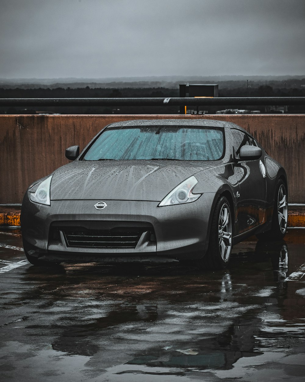 a silver sports car parked in a parking lot