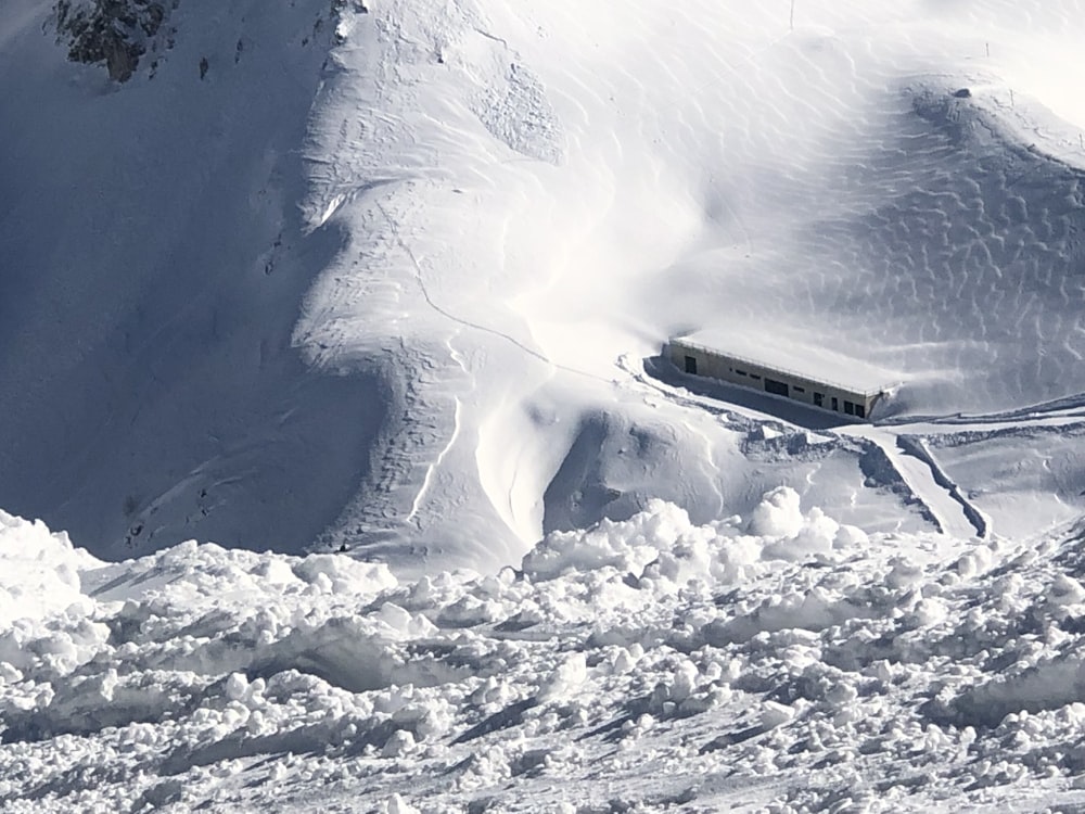 a train traveling through a snow covered mountain