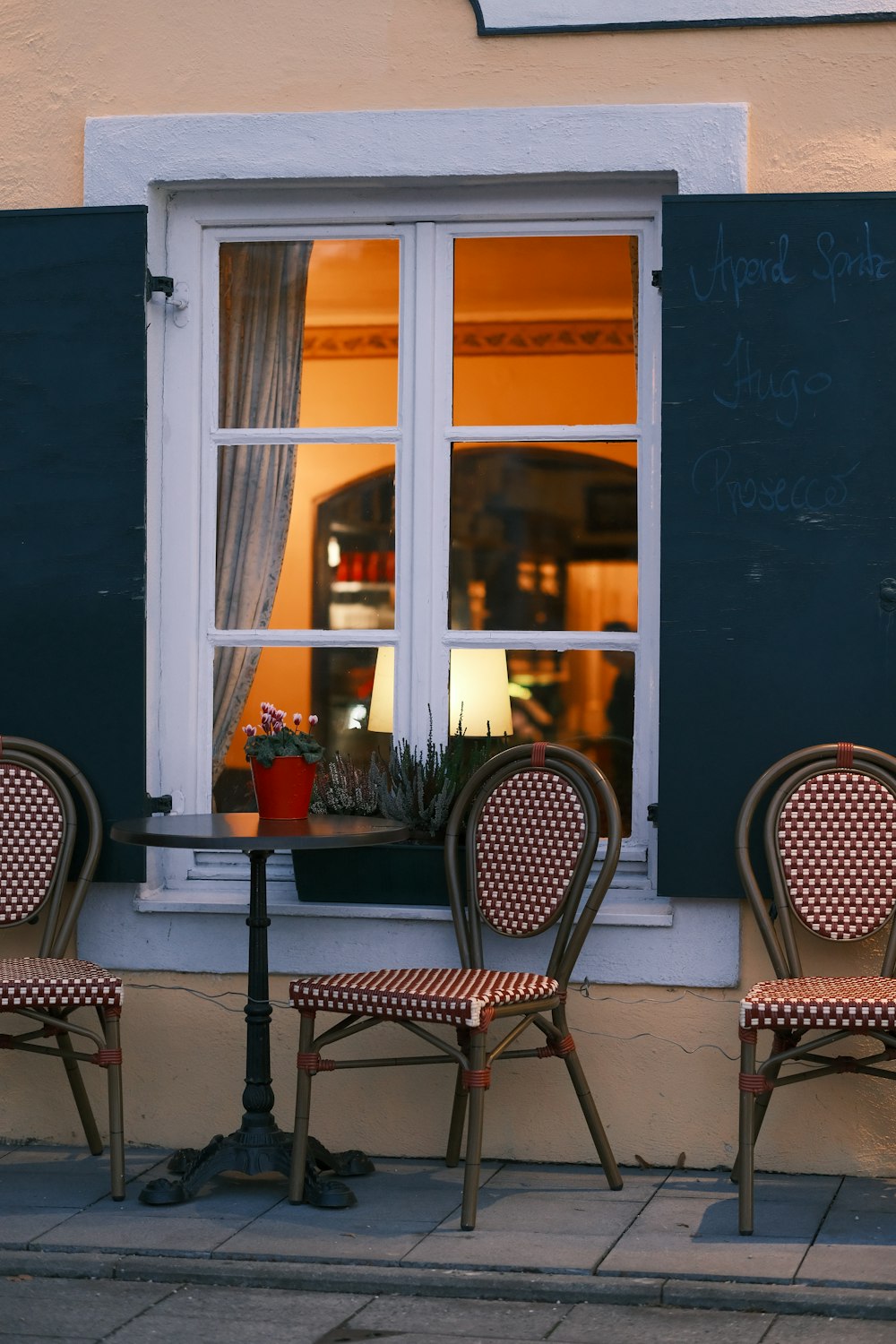 a couple of chairs sitting in front of a window