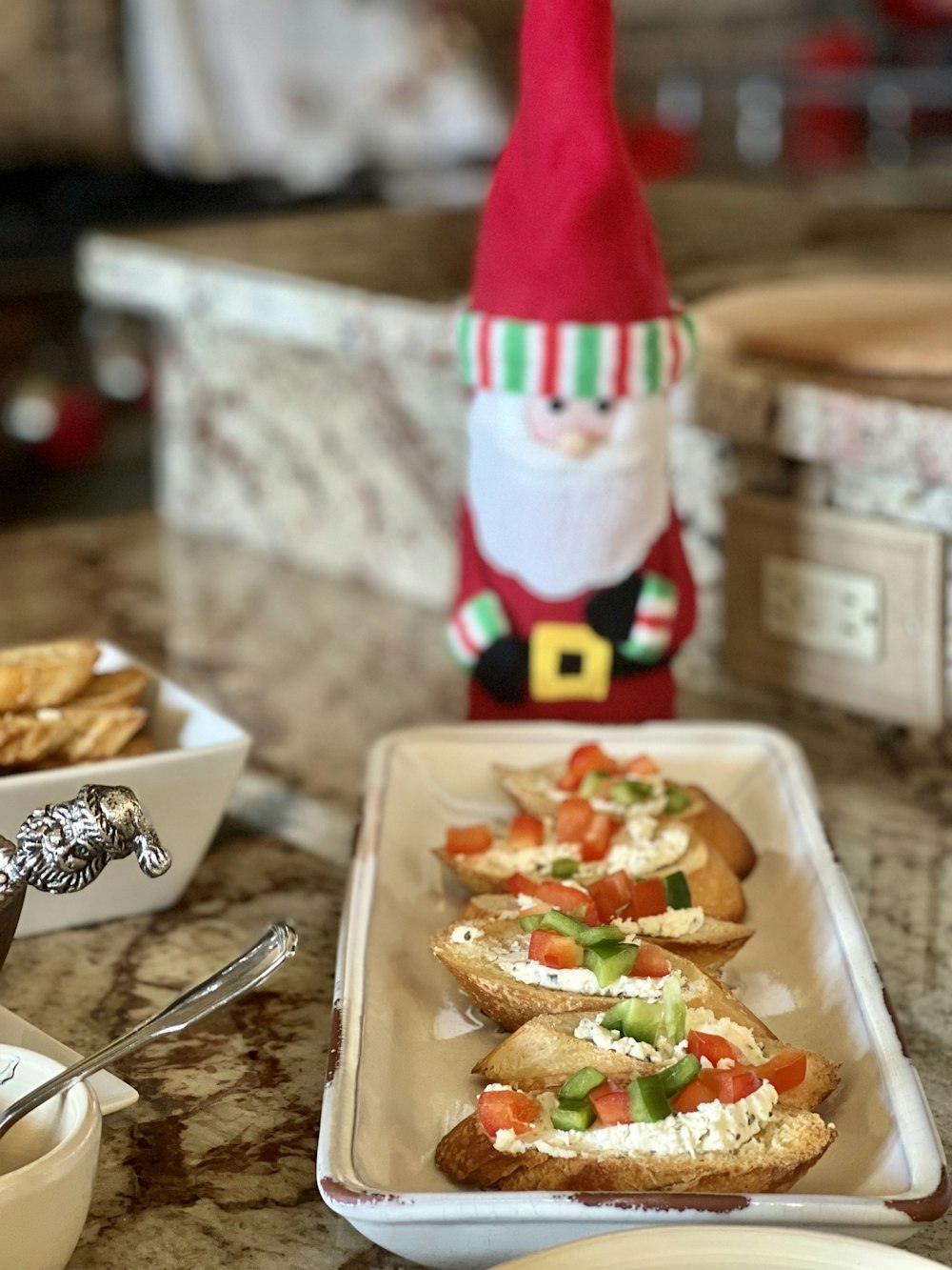 a table topped with trays of food and a gnome