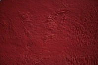 a close up of a red painted surface