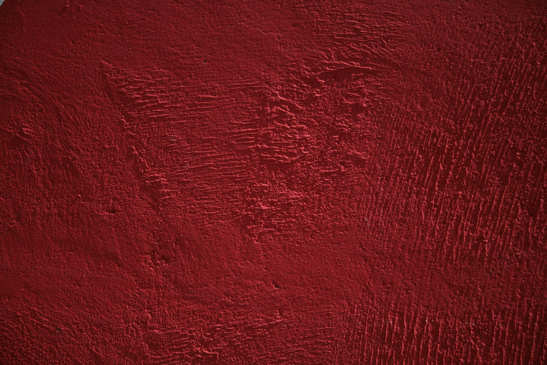 a close up of a red painted surface